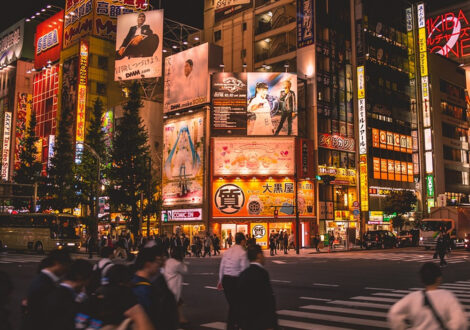 Bustling street scene in Tokyo, Japan — a top destination for business class flights from Los Angeles.