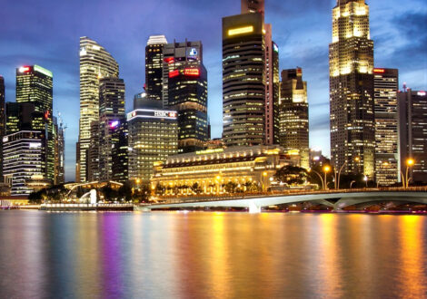 Singapore city skyline at dusk, a popular destination for business class flights from San Francisco.