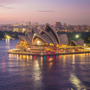 Sydney Opera House at sunset, a top highlight for travelers booking business class flights to Sydney, Australia.