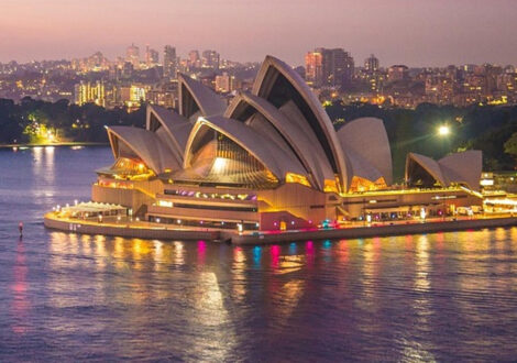 Sydney Opera House at sunset, a top highlight for travelers booking business class flights to Sydney, Australia.