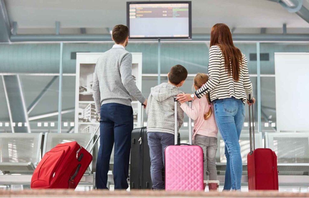 Family checking in for cheap business class tickets – luxury air travel made affordable