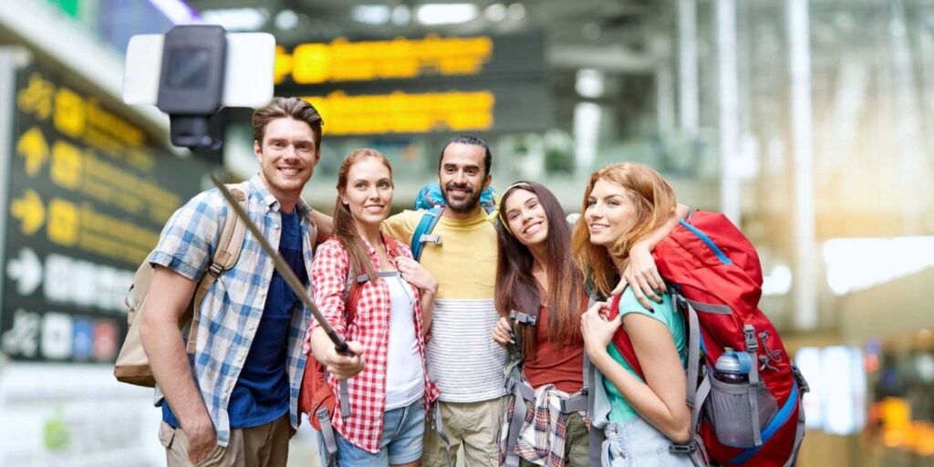 Group of happy passengers at airport representing safest airlines and flight safety