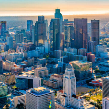 Aerial view of downtown Los Angeles at sunset, showing the city skyline — ideal destination for business class flights from New York.