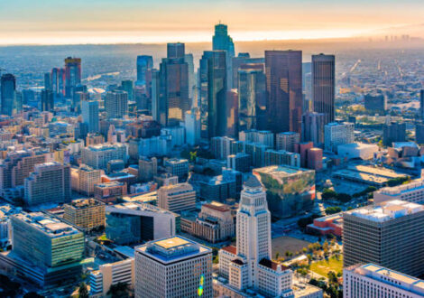 Aerial view of downtown Los Angeles at sunset, showing the city skyline — ideal destination for business class flights from New York.