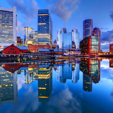 Boston city skyline at sunset – business class flights from Boston to Los Angeles with exclusive flight deals.